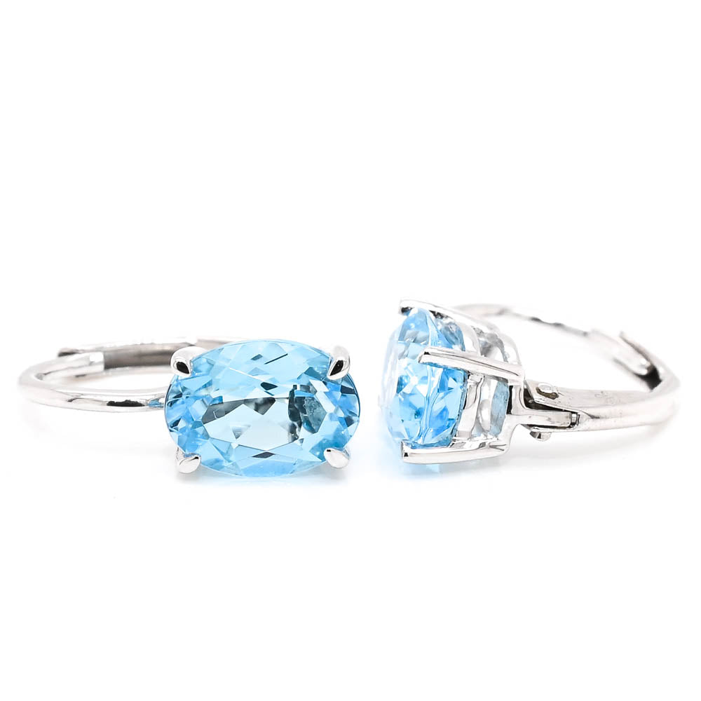 10KT White Gold 1.75CTW Oval Shape Swiss Blue Topaz Leverback Earrings.