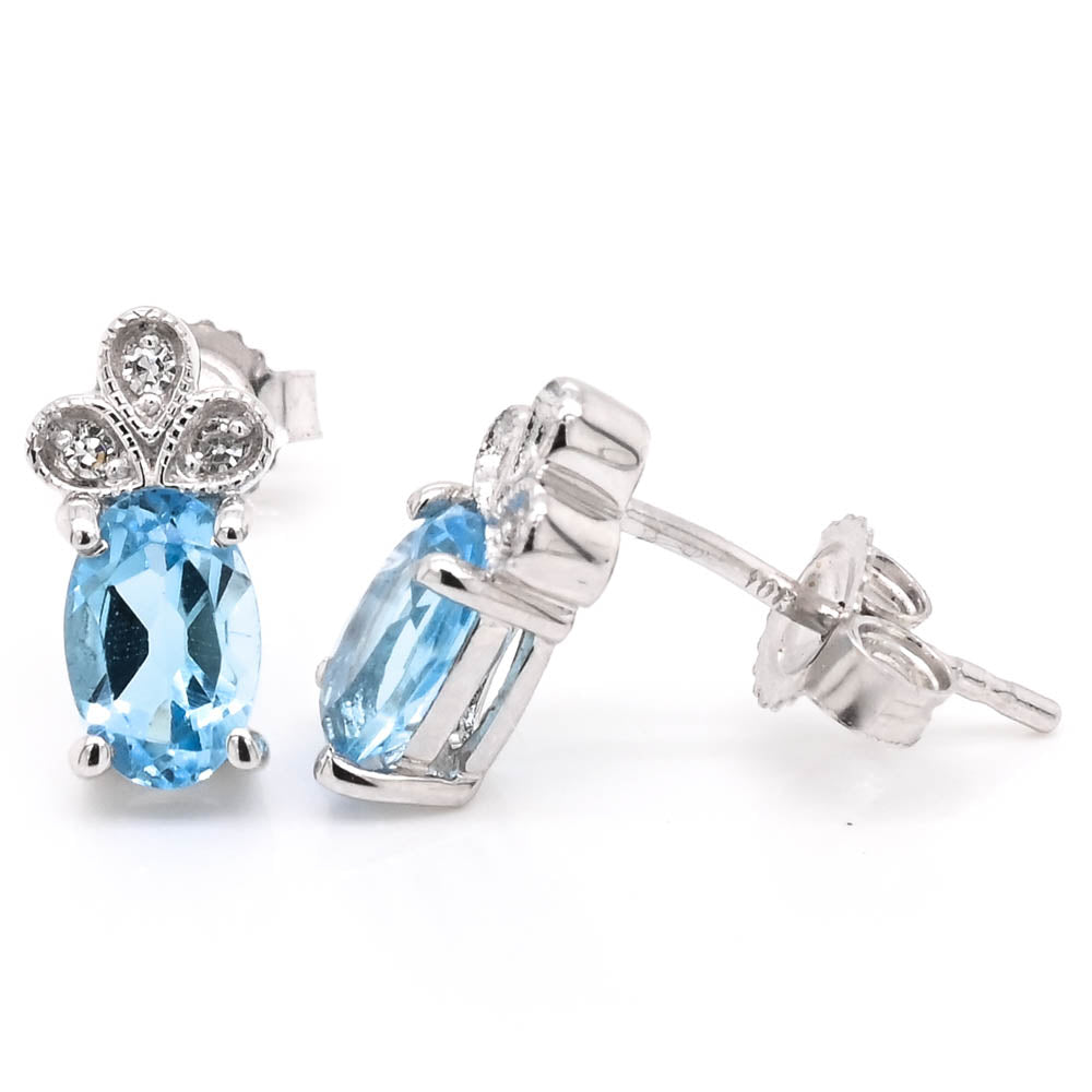 10KT White Gold Blue Topaz & Diamond Stud Earrings.
