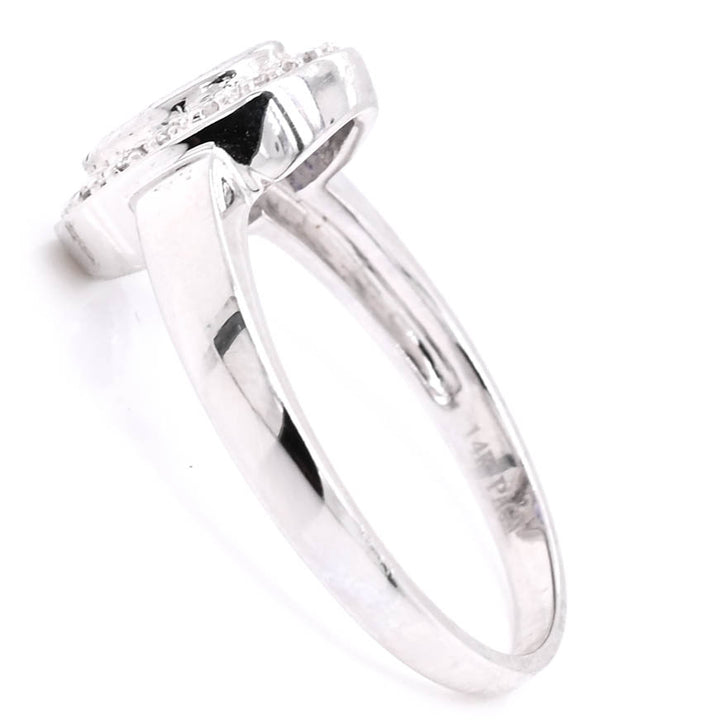 14KT White Gold val Shape Tanzanite & Diamond Ring.