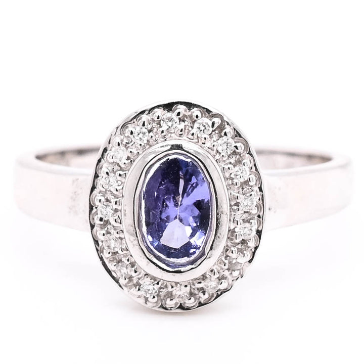 14KT White Gold val Shape Tanzanite & Diamond Ring.