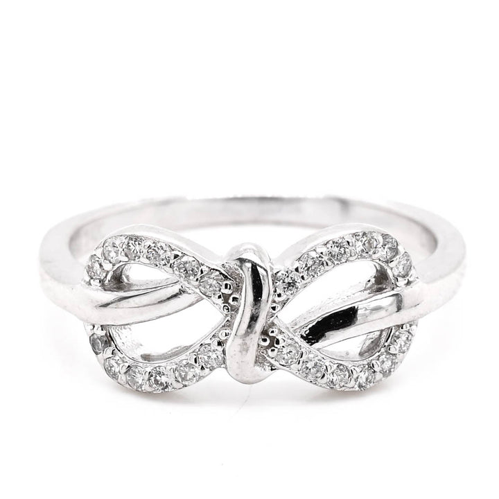 14KT White Gold 0.18CTW Diamond Infinity Knot Ring.