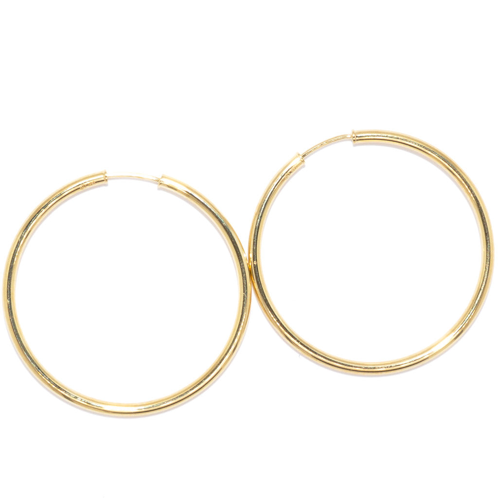 14 Karat Yellow Gold Medium Hoop Earrings.