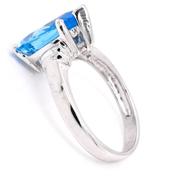 14KT White Gold Pear Shape Blue Topaz Solitaire Ring.