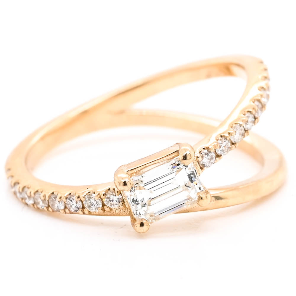 14KT Yellow Gold 0.60CTW Emerald Shape Canadian Diamond Ring.