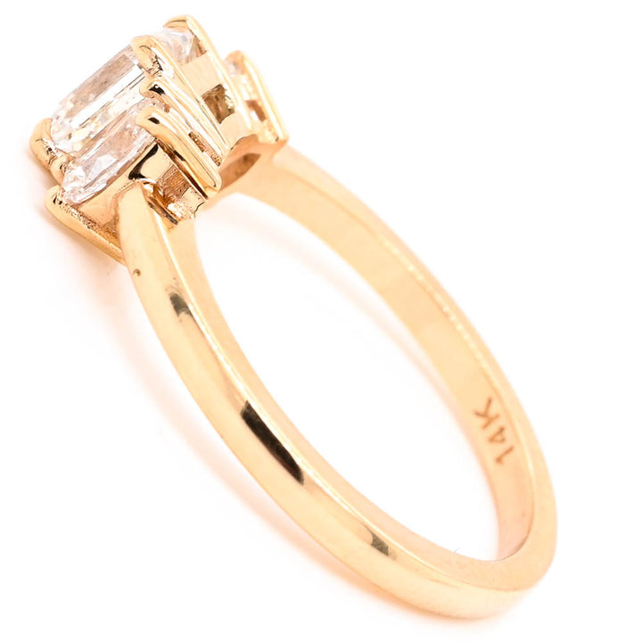 14KT Yellow Gold 1.53CTW Emerald Shape 3 Stone Diamond Engagement Ring.