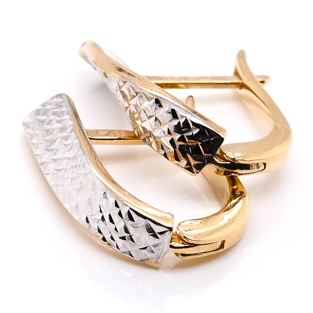 10KT Two-Tone Gold Oval Huggie Earrings.
