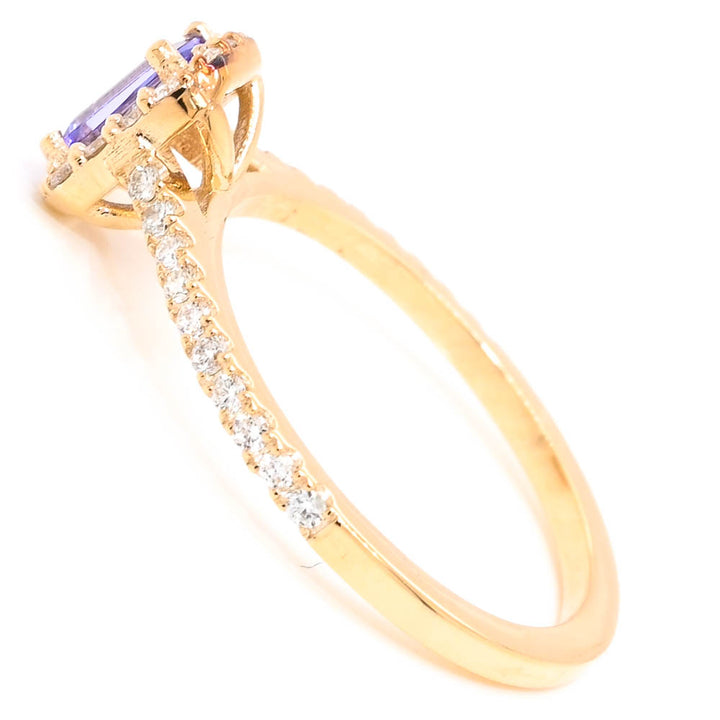 14KT Yellow Gold 0.26CT Emerald Shape Tanzanite & Diamond Halo Set Ring.