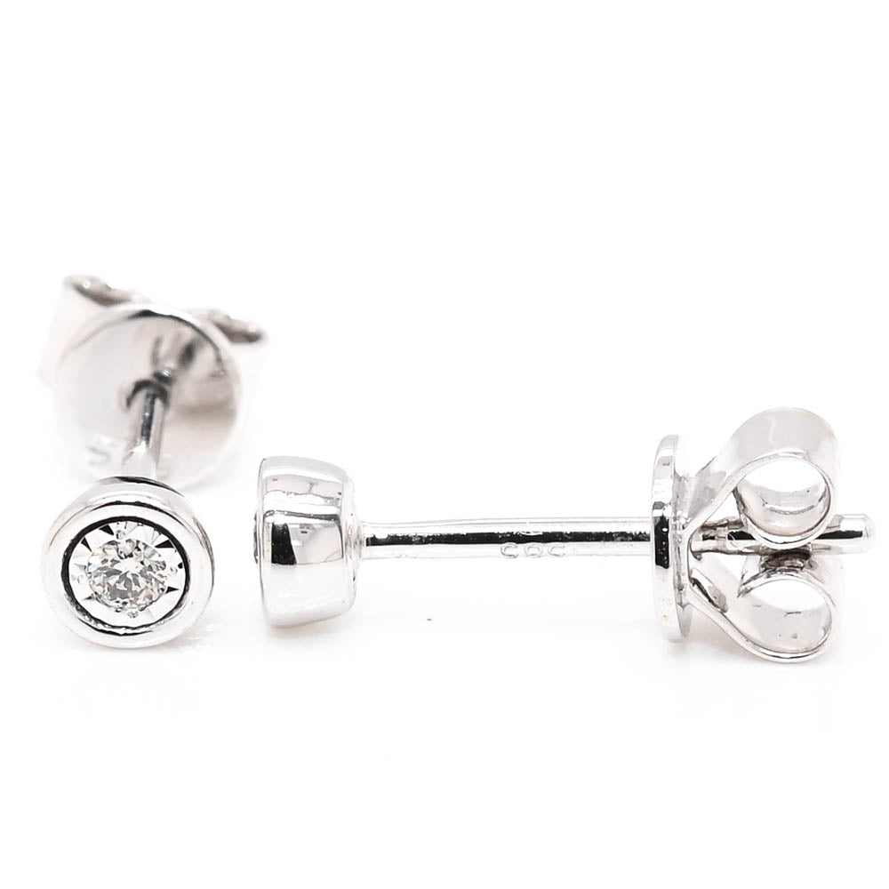 14KT White Gold 0.04CTW Diamond Bezel Set Earrings.