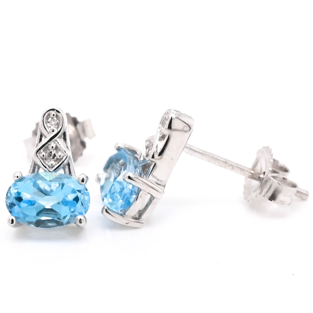 10KT White Gold Blue Topaz & Diamond Stud Earrings.