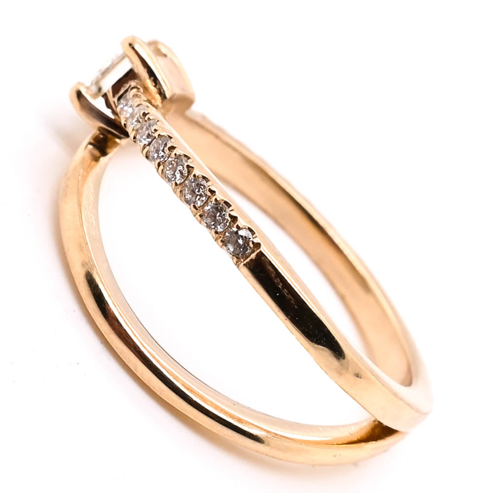 14KT Yellow Gold 0.60CTW Emerald Shape Canadian Diamond Ring.