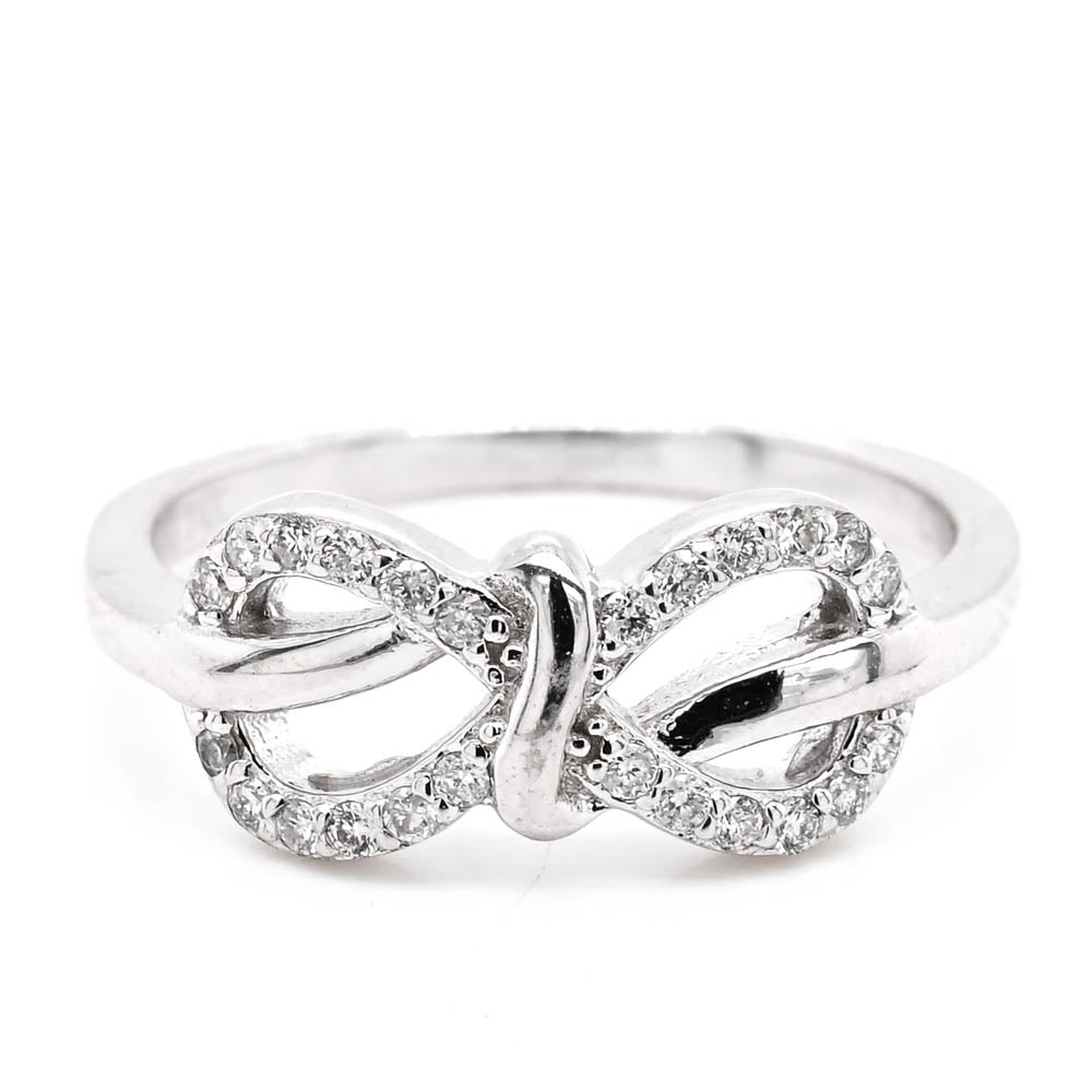 14KT White Gold 0.18CTW Diamond Infinity Knot Ring.