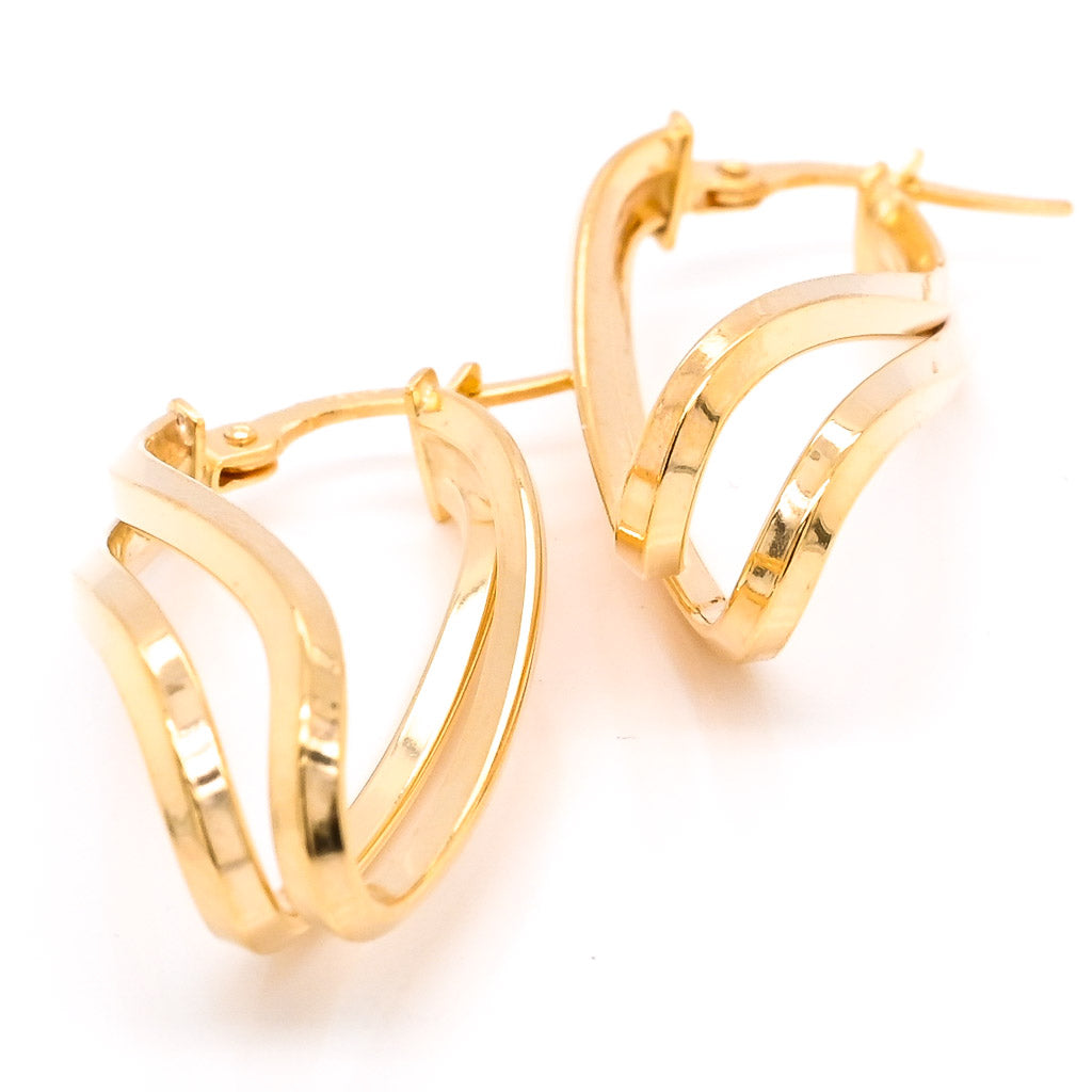 10 Karat Yellow Gold Oval Twisted Hoop Earrings.