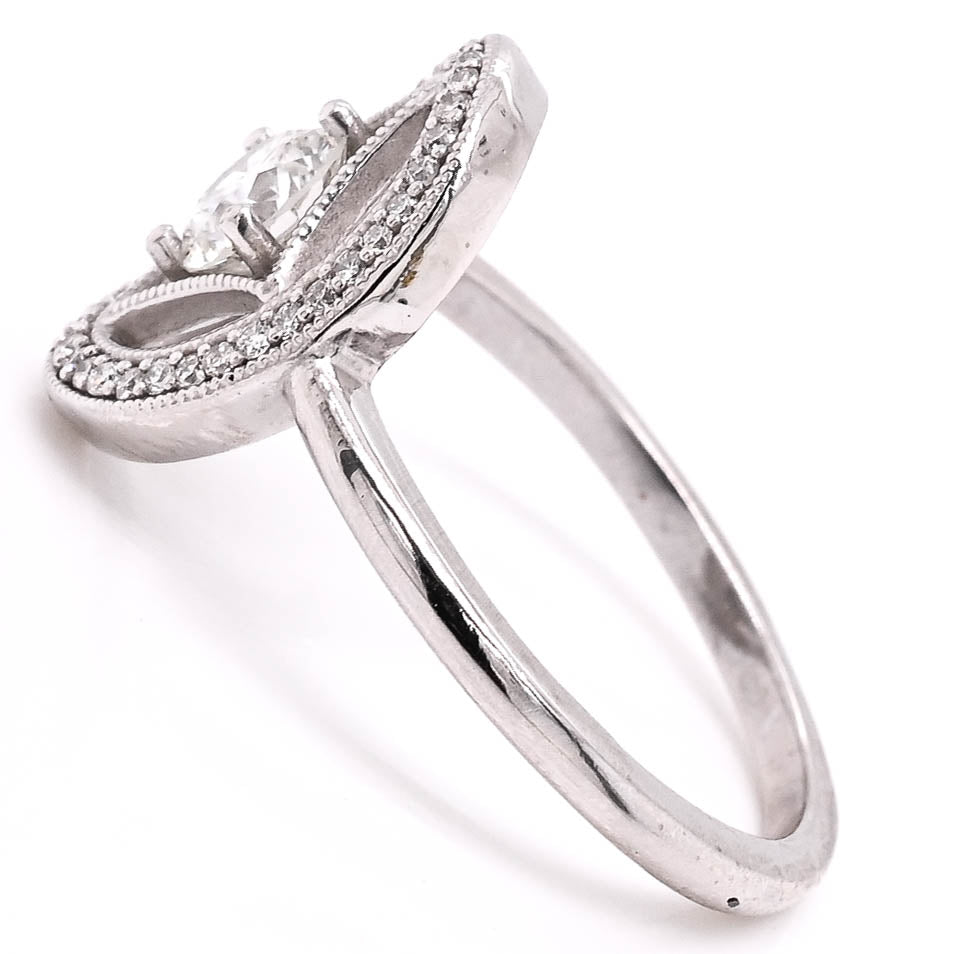 Platinum 0.66CTW Canadian Diamond Vintage Inspired Halo Set Ring.