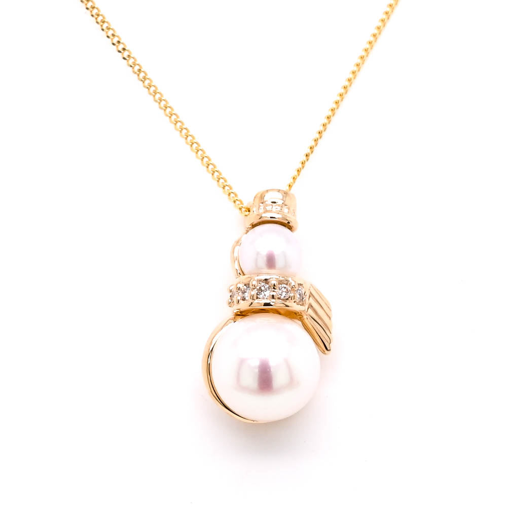 10KT Yellow Gold 18" 4-6.5mm Pearl & Diamond Snowman Necklace.