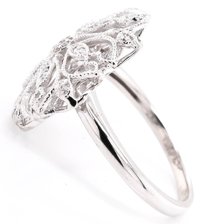 10KT White Gold 0.06CTW Diamond Flower Celebration Ring. 

Band Widt