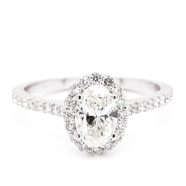 14KT White Gold 1.05CTW Oval Shape Diamond Halo Set Engagement Ring.