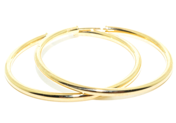 14 Karat Yellow Gold Medium Hoop Earrings.