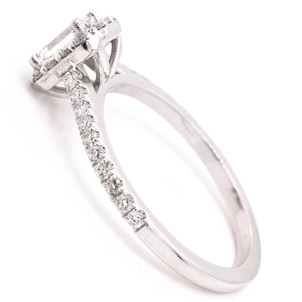 14KT White Gold 0.87CTW Emerald Shape Halo Set Canadian Diamond Engagement Ring.