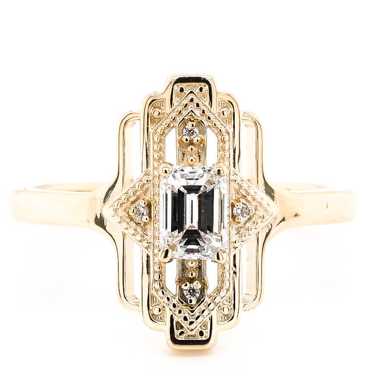 14KT Yellow Gold 0.46CTW Emerald Shape Canadian Diamond Ring.
