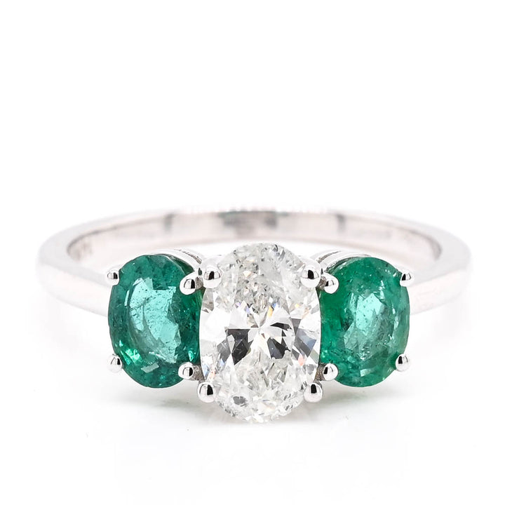 14KT White Gold 0.81CT Oval Shape Diamond & Emerald Ring..