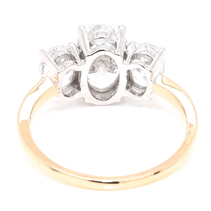 10KT Yellow & White Gold 2.50CTW Oval Shape Lab Created Diamond 3 Stone Engagement Ring.