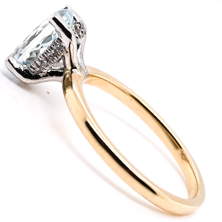 14KT White and Yellow Gold 1.17CT Oval Shape Aquamarine and Diamond Reverse Halo Set Ring.