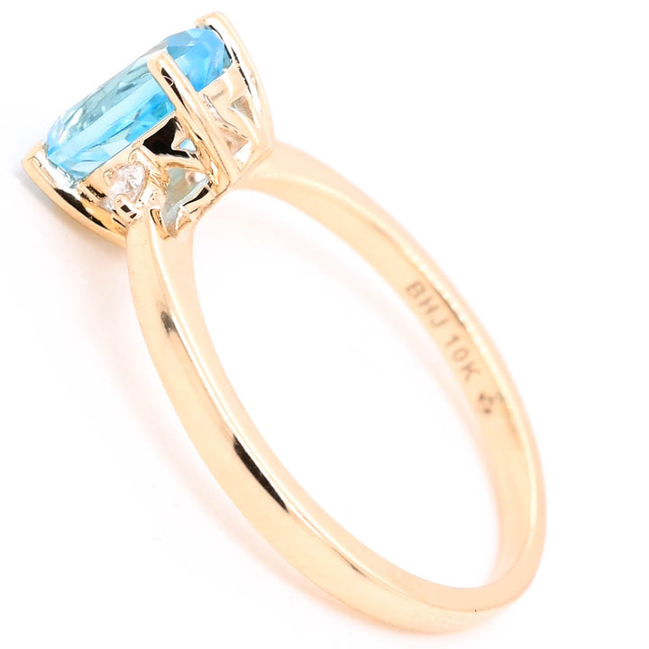 Fire & Ice 10KT Yellow Gold Blue Topaz & Canadian Diamond Ring.