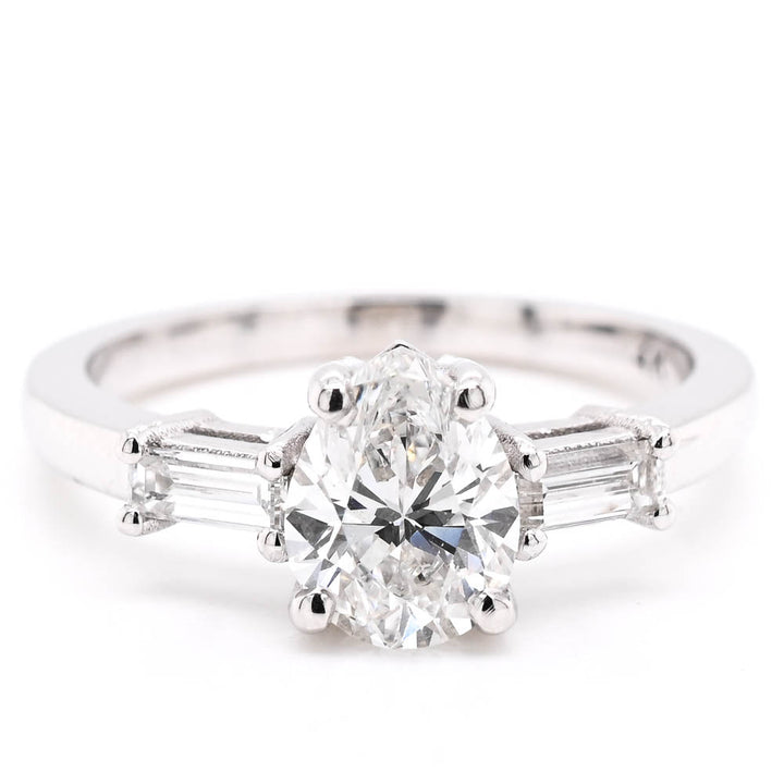 14KT White Gold 1.23CTW Pear Shape Diamond 3 Stone Engagement Ring.