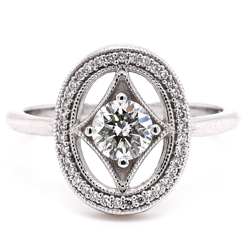 Platinum 0.66CTW Canadian Diamond Vintage Inspired Halo Set Ring.