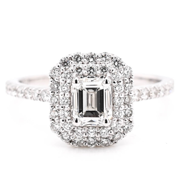14KT White Gold 1.10CTW Emerald Cut Canadian Diamond Double Halo Engagement Ring.