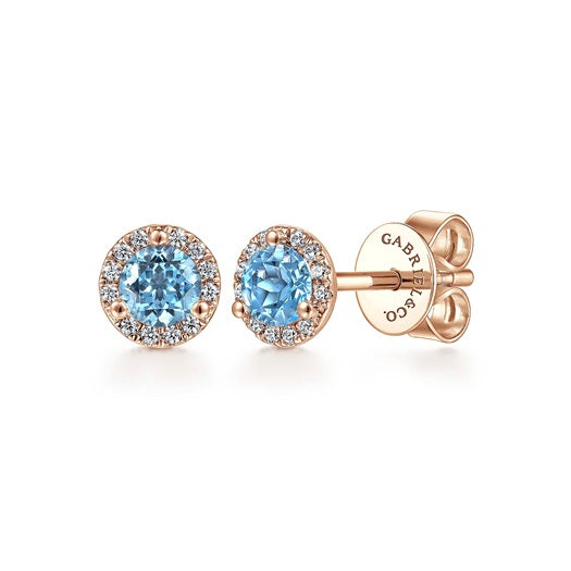 Gabriel & Co 14KT Rose Gold 0.32CTW Blue Topaz & Diamond Halo Set Stud Earrings.