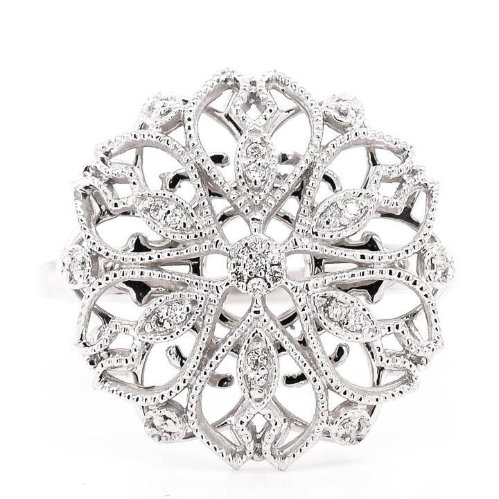 10KT White Gold 0.06CTW Diamond Flower Celebration Ring. 

Band Widt